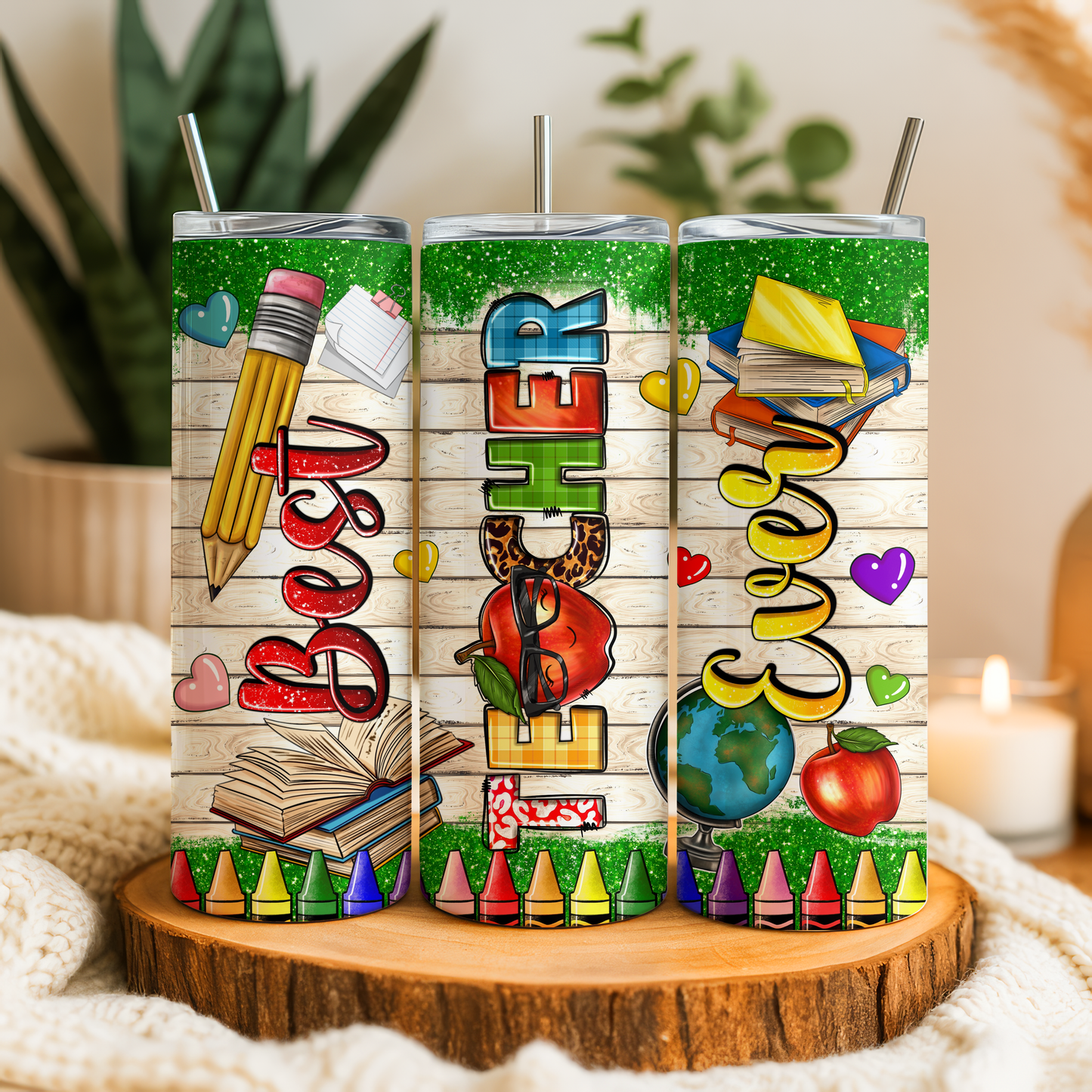 Three colorful tumblers with illustrations of school supplies and educational themes, including pencils, books, apples, and crayons, along with the text "Best Teacher", "EVERY Teacher", and "Teacher".