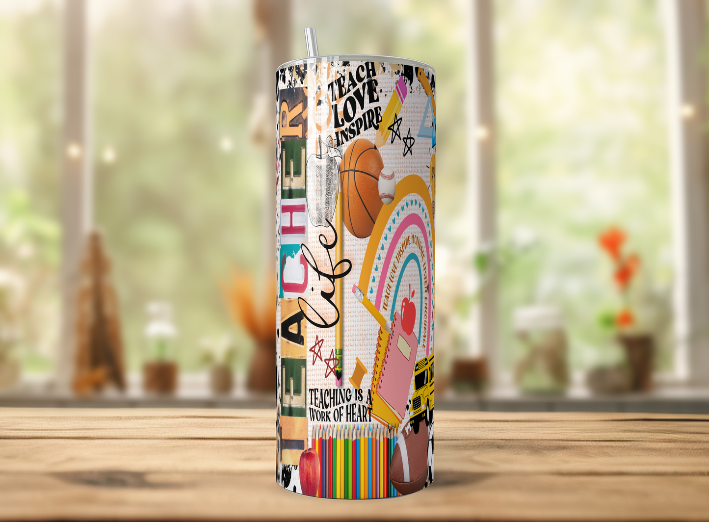 A colorful and vibrant tumbler with various school-related designs and text printed on it, placed on a wooden surface.