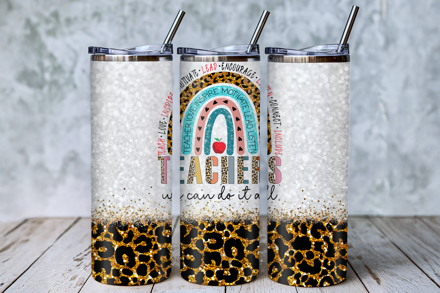 Three cylindrical tumblers with a leopard print design and text printed on them.