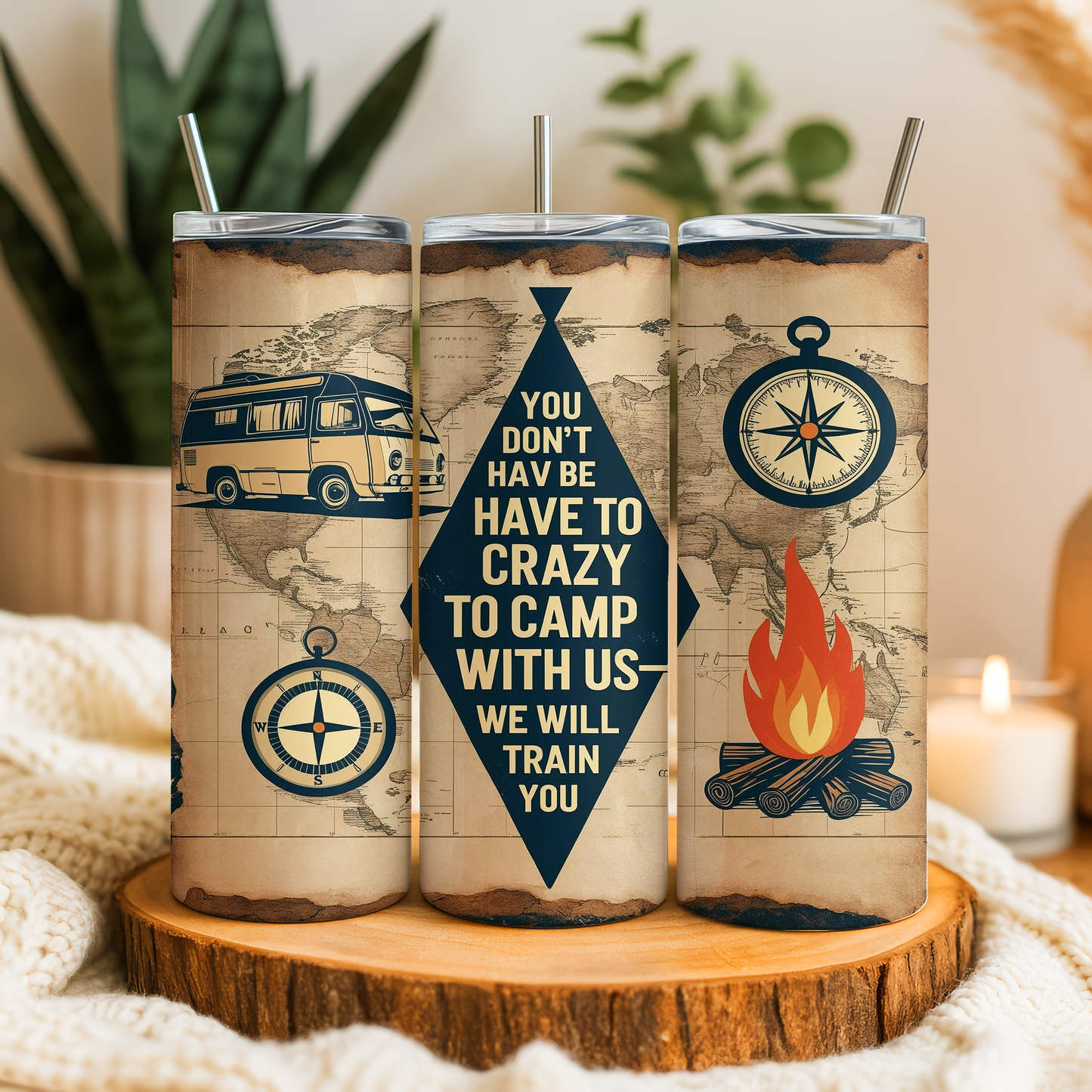 A set of three travel-themed tumblers with illustrations of a camper van, compass, and campfire, along with a motivational message about camping and adventure.