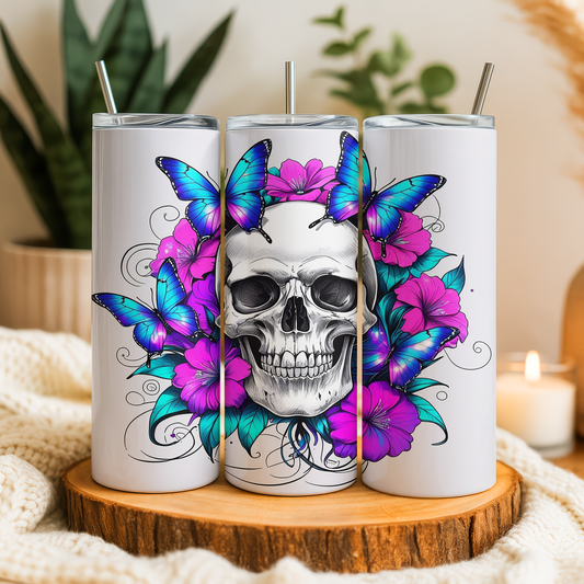 A triptych of white tumblers with a skull design and colorful butterflies on a floral background.