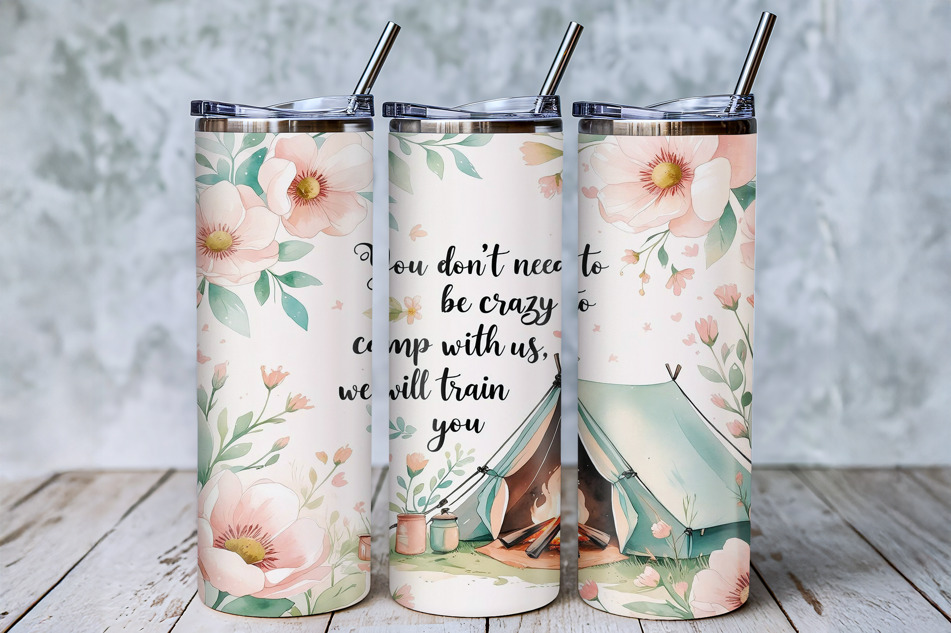 Three floral-patterned stainless steel tumblers with straws, each featuring a different design and text.