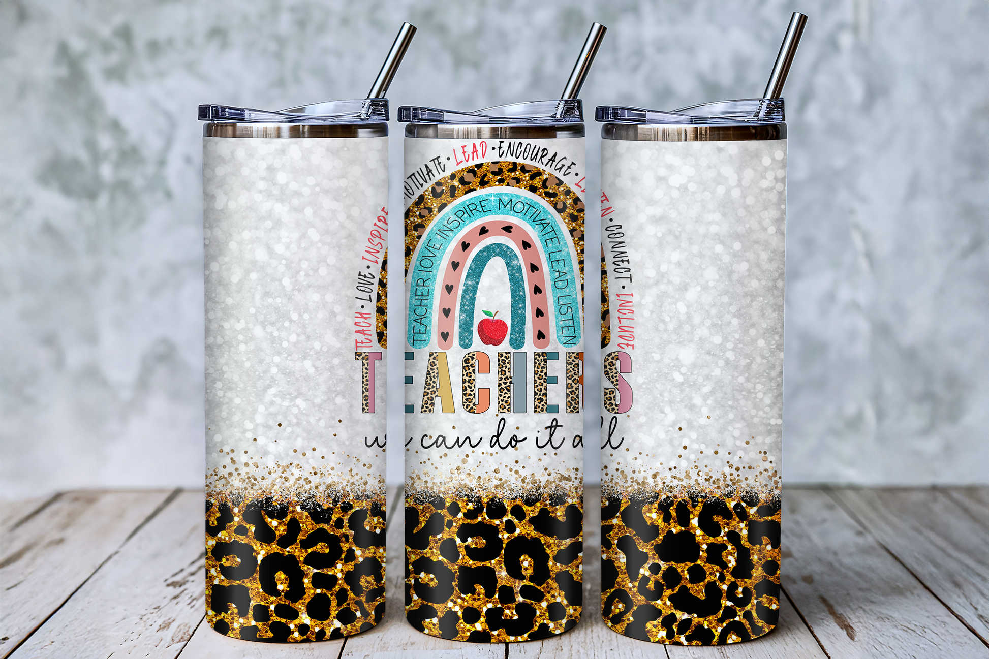 Three cylindrical tumblers with a leopard print design and text printed on them.