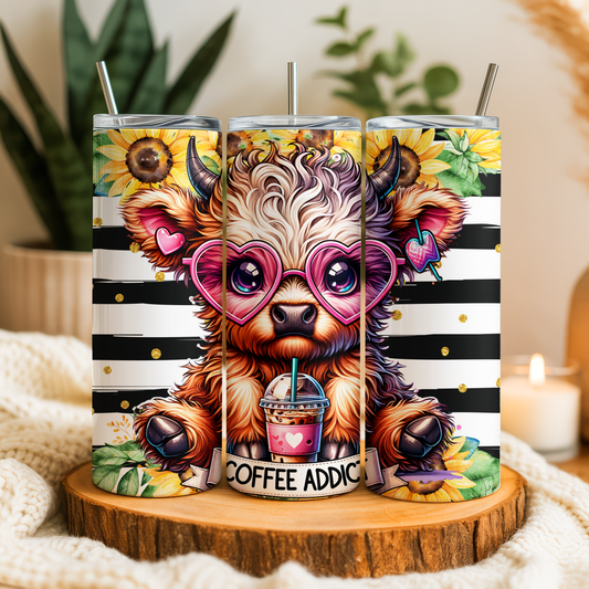 A colorful and whimsical tumbler with a cartoon cow design, wearing sunglasses and holding a coffee cup.